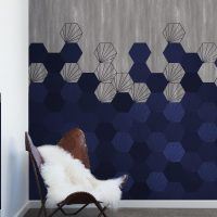 blue concrete tiles geometric design set against a concrete background. Custom digitally printed wallcovering for commercial interiors.
