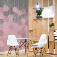 pink concrete tiles geometric design set against a concrete background. Custom digitally printed wallcovering for commercial interiors.
